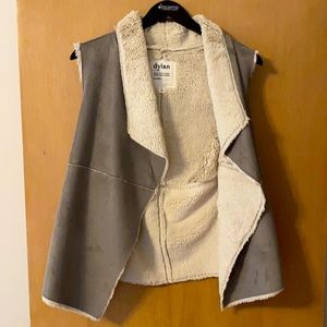Suede vest with light layer of fur lining.